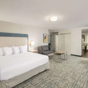 Spacious day use room with sofa and work desk at Homewood Suites By Hilton Miami Airport-Blue Lagoon.