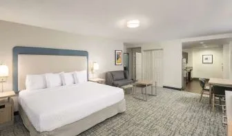 Spacious day use room with sofa and work desk at Homewood Suites By Hilton Miami Airport-Blue Lagoon.