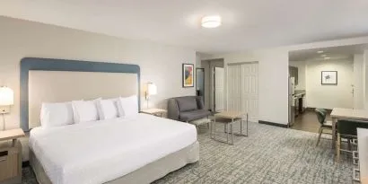 Spacious day use room with sofa and work desk at Homewood Suites By Hilton Miami Airport-Blue Lagoon.