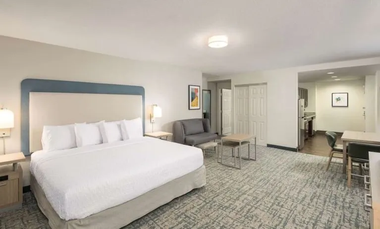 Spacious day use room with sofa and work desk at Homewood Suites By Hilton Miami Airport-Blue Lagoon.