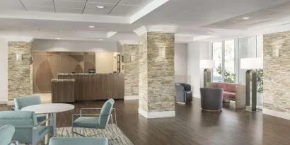 Lobby and coworking lounge at Homewood Suites By Hilton Miami Airport-Blue Lagoon.
