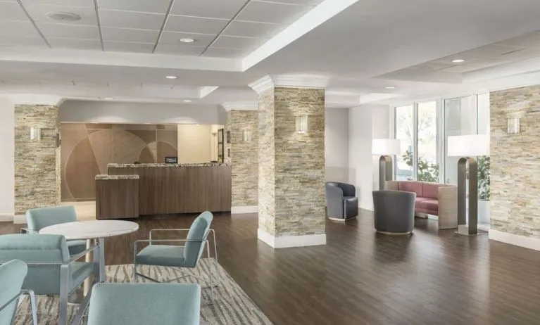 Lobby and coworking lounge at Homewood Suites By Hilton Miami Airport-Blue Lagoon.