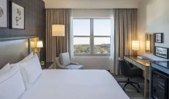 Day use room with work desk and natural light at Hilton San Antonio Hill Country.