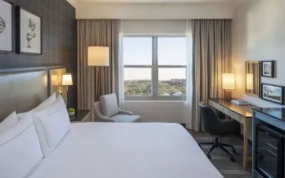 Day use room with work desk and natural light at Hilton San Antonio Hill Country.