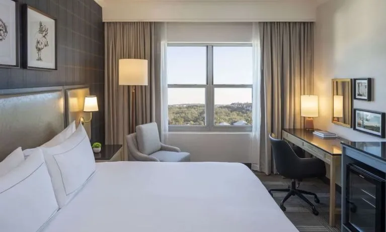 Day use room with work desk and natural light at Hilton San Antonio Hill Country.