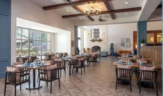 Dining area with natural light perfect for coworking at Hilton San Antonio Hill Country.