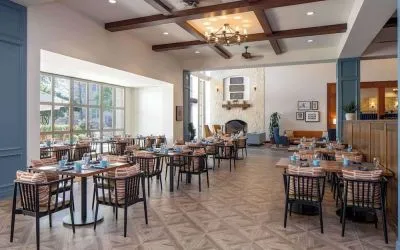 Dining area with natural light perfect for coworking at Hilton San Antonio Hill Country.