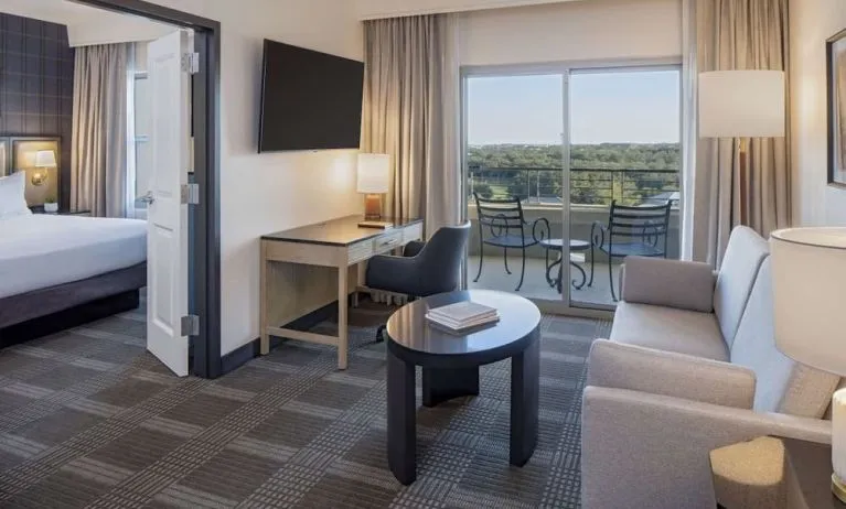 Day use room with living area and balcony at Hilton San Antonio Hill Country.