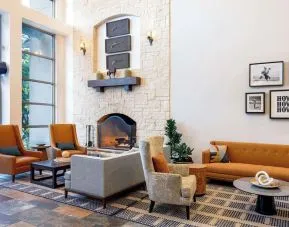 Lobby and coworking lounge at Hilton San Antonio Hill Country.