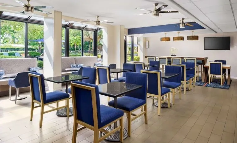 Dining and coworking space at Hampton Inn Ft. Lauderdale-Cypress Creek.