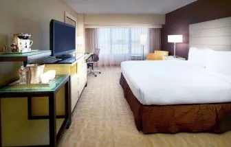 Day use room with work desk and natural light at Hilton Los Angeles Airport.