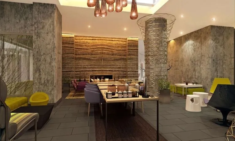 Lobby lounge and workspace with coffee service and fireplace at Hilton Garden Inn New York/Manhattan-Midtown East.