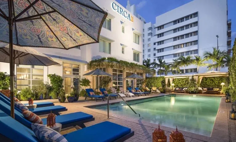 Outdoor pool with lounge seating at Circa 39 Hotel.
