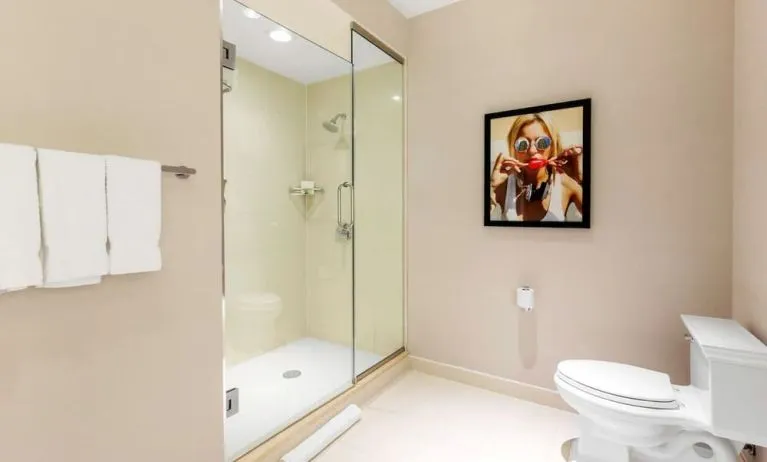 Private guest bathroom with shower and free toiletries at The Chicago Hotel Collection - Magnificent Mile.