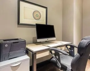 Business center with computer, printer and ergonomic chair at The Chicago Hotel Collection - Magnificent Mile.