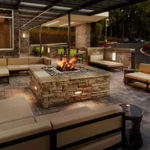 Patio with lounge seating and fire pit at 	SpringHill Suites Atlanta Northwest.
