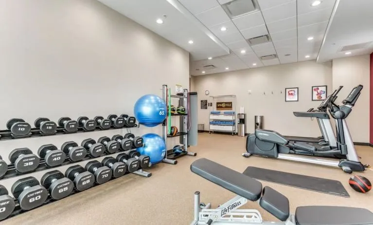 Well equipped fitness center at Home2 Suites By Hilton Dallas Medical District Lovefield.