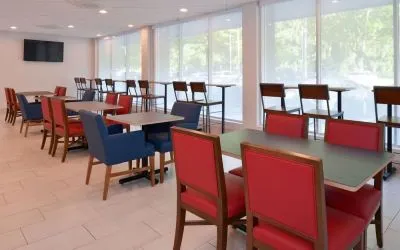 Dining area with comfortable seating at Holiday Inn Express Towson Baltimore North.