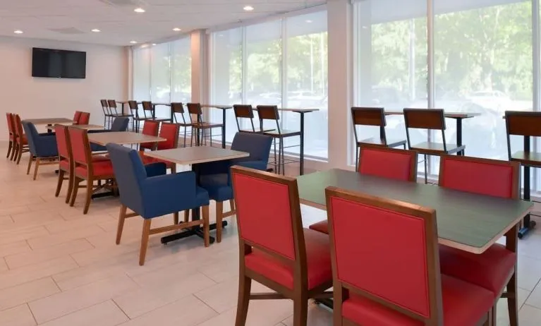 Dining area with comfortable seating at Holiday Inn Express Towson Baltimore North.