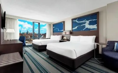 Day use twin room with work desk and living area at Courtyard Boston Cambridge.