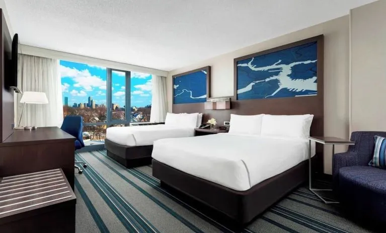 Day use twin room with work desk and living area at Courtyard Boston Cambridge.
