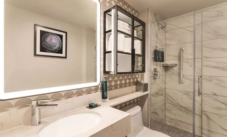 Private guest bathroom with shower and free toiletries at DoubleTree By Hilton New York Midtown Fifth Ave.