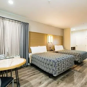 Day use twin room with workspace at Palace Inn Blue IAH East.