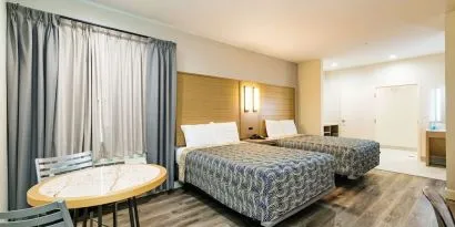 Day use twin room with workspace at Palace Inn Blue IAH East.