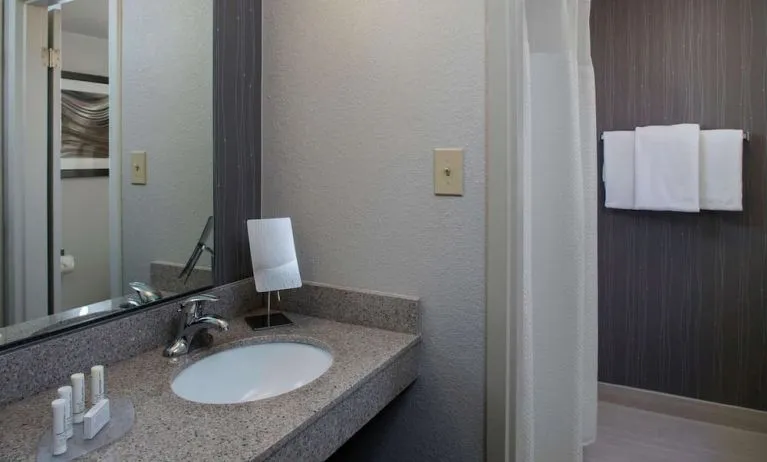 Private guest bathroom with shower and free toiletries at Sonesta Select Atlanta Norcross I-85.