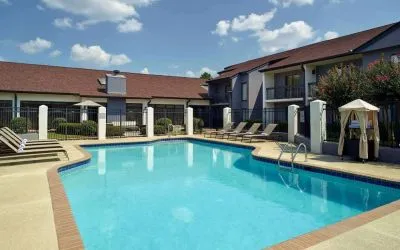 Outdoor pool with lounge chairs at Sonesta Select Atlanta Norcross I-85.