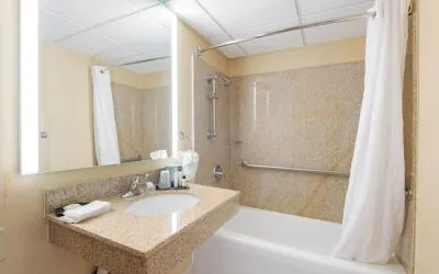 Private guest bathroom with free toiletries at Wyndham Omaha.