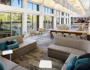 Lobby lounge seating and workspace at Element Miami International Airport.