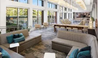 Lobby lounge seating and workspace at Element Miami International Airport.