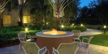 Outdoor lounge seating and fire pit at Element Miami International Airport.
