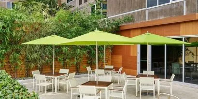 Hotel patio with seating at Element Miami International Airport.
