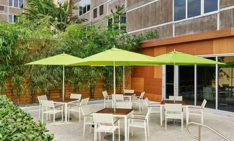 Hotel patio with seating at Element Miami International Airport.