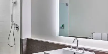 Private guest bathroom with shower at Element Miami International Airport.