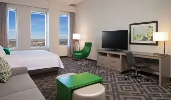 Day use room with work desk and sofa at Homewood Suites By Hilton LAX Airport.