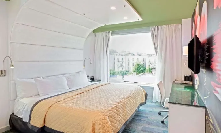 King room with comfortable bed and work desk at Wyndham Garden Brooklyn Sunset Park.
