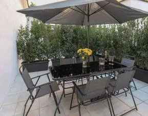 Outdoor terrace at Aiello Hotels - CityLife Apartments.