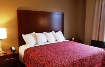 King bed at Days Inn By Wyndham Brooklyn Marine Park.