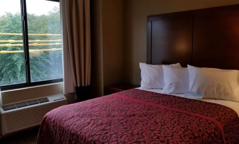 Day use room with large window and private bathroom at Days Inn By Wyndham Brooklyn Marine Park.
