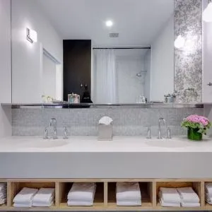 Private guest bathroom with shower and free toiletries at Nu Hotel - Brooklyn.