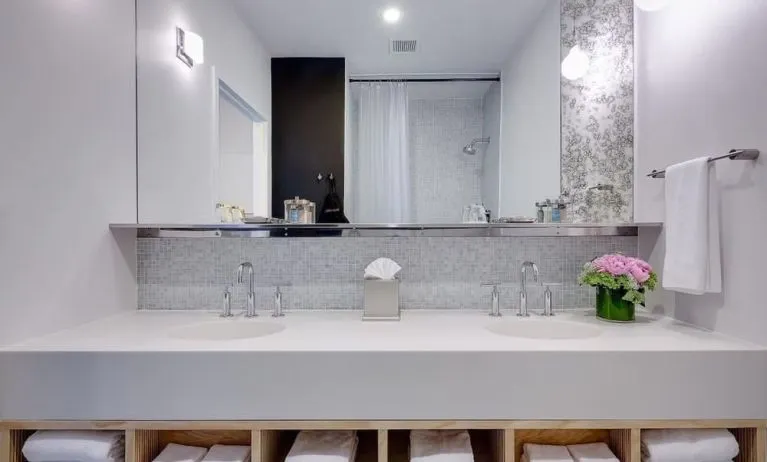 Private guest bathroom with shower and free toiletries at Nu Hotel - Brooklyn.