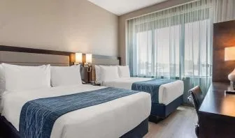 Day use twin room with large windows, work desk and private bathroom at Comfort Inn Prospect Park-Brooklyn.