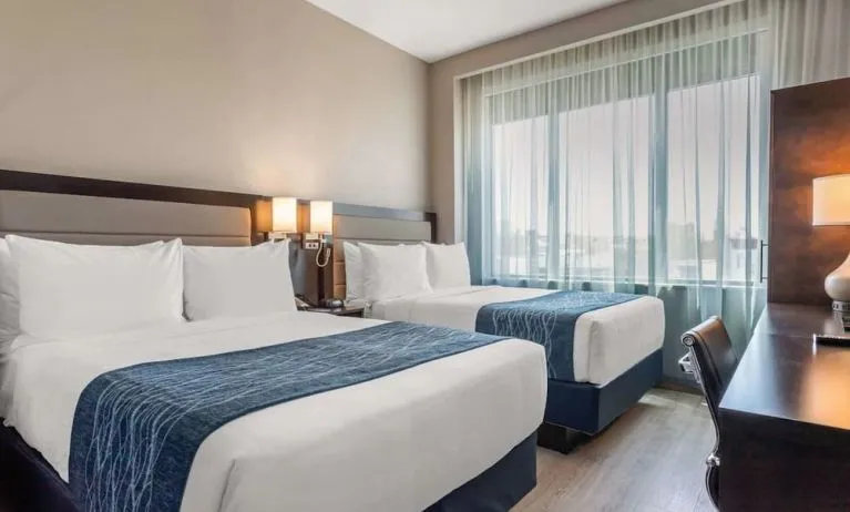 Day use twin room with large windows, work desk and private bathroom at Comfort Inn Prospect Park-Brooklyn.