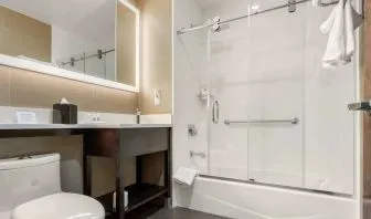 Private guest bathroom with free toiletries at Comfort Inn Prospect Park-Brooklyn.