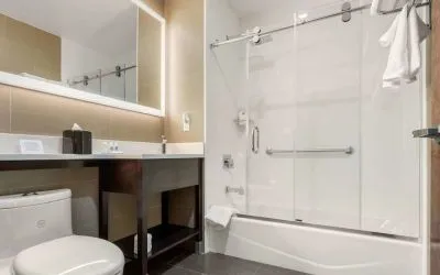 Private guest bathroom with free toiletries at Comfort Inn Prospect Park-Brooklyn.