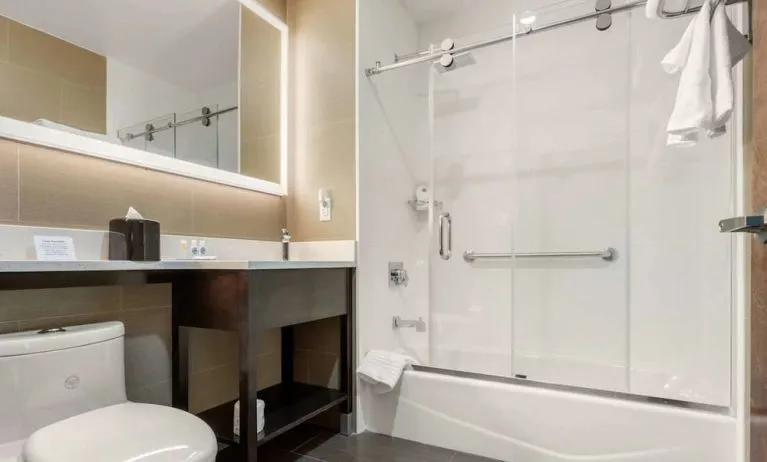 Private guest bathroom with free toiletries at Comfort Inn Prospect Park-Brooklyn.