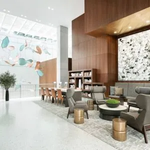 Lobby workspace and lounge area at AC Hotel New York Times Square.